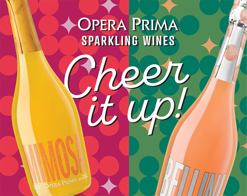 Two bottles of Opera Prima sparkling wines, Mimosa and Bellini, are shown against a colorful, retro-style background. The text reads: Opera Prima Sparkling Wines. Cheer it up!.